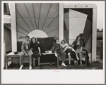 Group of tired people resting at state fair, Donaldsonville, Louisiana