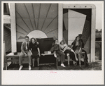 Group of tired people resting at state fair, Donaldsonville, Louisiana
