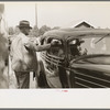 Ticket taker at gate, state fair, Donaldsonville, Louisiana