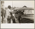 Ticket taker at gate, state fair, Donaldsonville, Louisiana