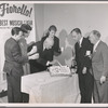 Director-coauthor George Abbott cuts the cake at the first birthday party backstage for "Fiorello!," the Pulitzer Prize musical comedy