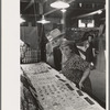 Man and woman looking at display of cheap jewelry, state fair, Donaldsonville, Louisiana