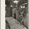 Man and woman looking at display of cheap jewelry, state fair, Donaldsonville, Louisiana
