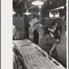 Man and woman looking at display of cheap jewelry, state fair, Donaldsonville, Louisiana