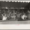 Concession with barker, state fair, Donaldsonville, Louisiana
