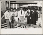 Baseball-throwing concession with man about ready to buy a throw, state fair, Donaldsonville, Louisiana