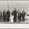 Chaplain praying from the main platform, opening the state fair, Donaldsonville, Louisiana