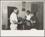 Playing game of "horses" with dice-shaking for the drinks, Pilottown, Louisiana