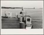 Pilot stepping from pilot boat to dock, Pilottown, Louisiana