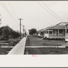 Row of cottages, Burrwood, Louisiana. This is chiefly a base for dredging operations of U.S. Engineering Corps