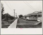 Row of cottages, Burrwood, Louisiana. This is chiefly a base for dredging operations of U.S. Engineering Corps