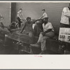 People sitting on dock, New Orleans, Louisiana