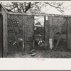 Side wall of old house dating from early nineteenth century showing details of construction. Showing use of mud and moss as filling agent. Near Edgard, Louisiana