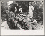 Residents at Boothville, Louisiana sitting on dock