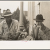 Two men in front of post office, Lafayette, Louisiana