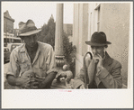 Two men in front of post office, Lafayette, Louisiana