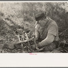 Migrant cane chair maker on U.S. 90 near Jeanerette, Louisiana