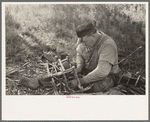 Migrant cane chair maker on U.S. 90 near Jeanerette, Louisiana