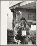 Negro eating lunch in cane fields near New Iberia, Louisiana