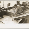 Loading shaved ice into shrimp boat, Morgan City, Louisiana