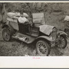 Farmer sitting in broken down Ford truck waiting for garageman near Amite, Louisiana