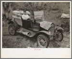 Farmer sitting in broken down Ford truck waiting for garageman near Amite, Louisiana