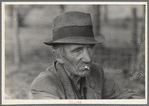 Migrant worker resting along roadside, Hancock County, Mississippi
