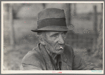 Migrant worker resting along roadside, Hancock County, Mississippi