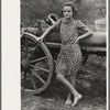 Farm girl leaning on wagon, near Morganza, Louisiana