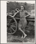 Farm girl leaning on wagon, near Morganza, Louisiana