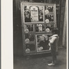 Little boy looking at movie display, New Iberia, Louisiana