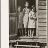Children of day laborer in doorway of their home near New Iberia, Louisiana