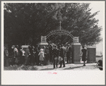 On All Saints' Day at New Roads, Louisiana Negroes assembeled in the church for preliminary ceremonies and then marched en masse to the cemetery for ceremonies there. Part of the group is shown entering the cemetery