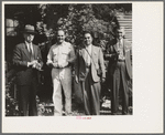 Allen Ramsey Wurtele, second from left, inventor of mechanical sugarcane harvester with sugarcane experts who came up from General International Convention to see his harvester. Mix, Louisiana