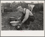 Day laborer working around his shack near New Iberia, Louisiana