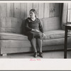 Wife of Chicot Farms homesteader sitting on homemade sofa, Chicot Farms, Arkansas