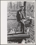 Farmer of Chicot Farms, Arkansas resting after chopping wood