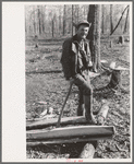 Farmer of Chicot Farms, Arkansas resting after chopping wood
