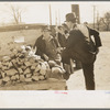 Man talking to farmer with truckload of wood, Laurel, Mississippi