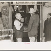 Merchant talking to prospective customer, Laurel, Mississippi