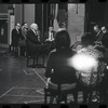 George Abbott [front] and unidentified others in rehearsal for the stage production Flora, the Red Menace