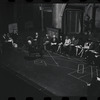 George Abbott [front] and unidentified others in rehearsal for the stage production Flora, the Red Menace