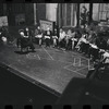 George Abbott [front] and unidentified others in rehearsal for the stage production Flora, the Red Menace