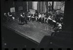 George Abbott [front] and unidentified others in rehearsal for the stage production Flora, the Red Menace