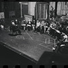 George Abbott [front] and unidentified others in rehearsal for the stage production Flora, the Red Menace