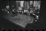 George Abbott [front] and unidentified others in rehearsal for the stage production Flora, the Red Menace