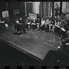 George Abbott [front] and unidentified others in rehearsal for the stage production Flora, the Red Menace