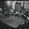 George Abbott [front] and unidentified others in rehearsal for the stage production Flora, the Red Menace