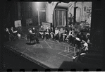 George Abbott [front] and unidentified others in rehearsal for the stage production Flora, the Red Menace