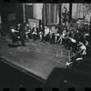 George Abbott [front] and unidentified others in rehearsal for the stage production Flora, the Red Menace